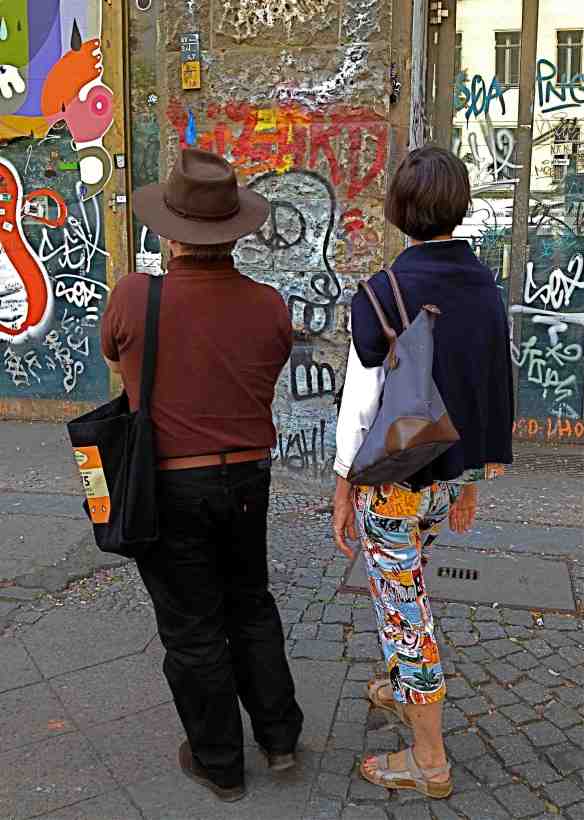 Looking at street grafiks. (Photo-© 2014 Louise Graber) 